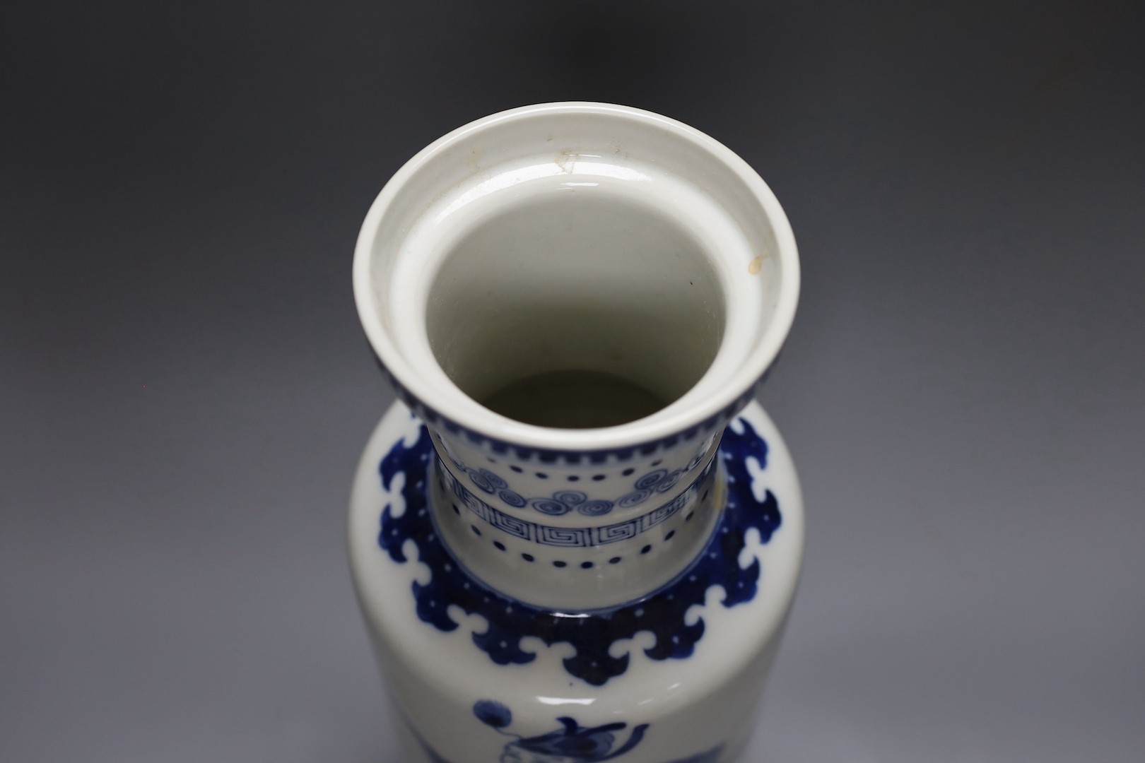 A Chinese blue and white rouleau vase, 35 cms.